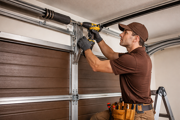 Professional technician servicing garage door with care and precision